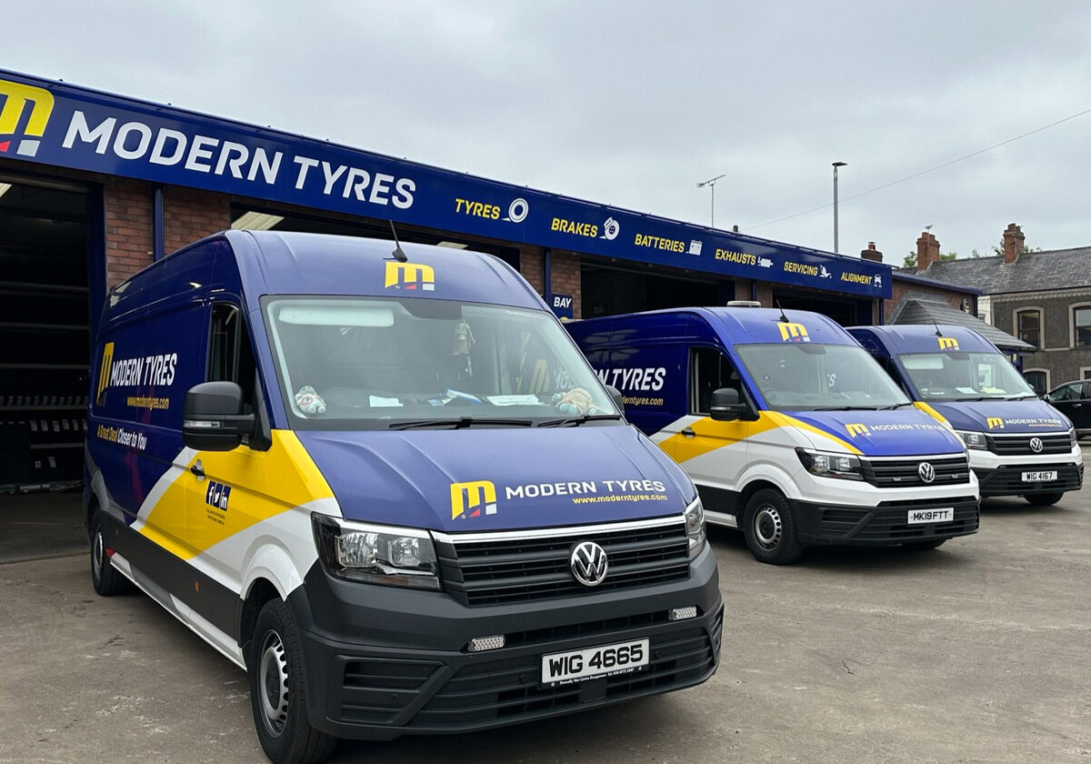 Modern Tyres vans lined up outside a depot